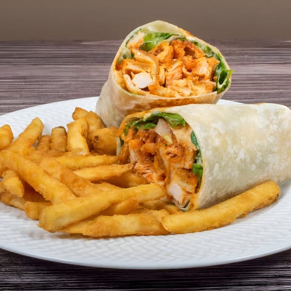 Two chicken wraps with lettuce and buffalo sauce, served with a side of golden french fries.
